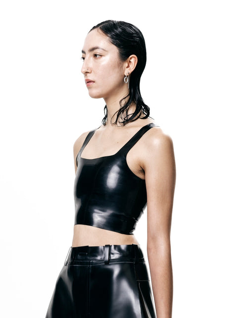 Black Cropped Fitted Tank Top by HARRI modeled with high-waisted black pants on white background