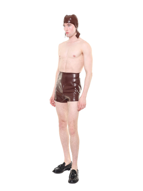 Male model wearing brown high waist essential biker shorts by HARRI paired with black shoes