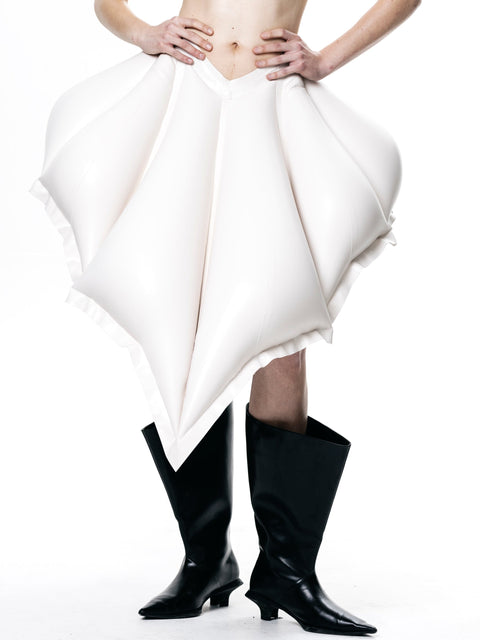 White V-Waisted Inflatable Midi Skirt by HARRI EXCLUSIVE worn with black boots