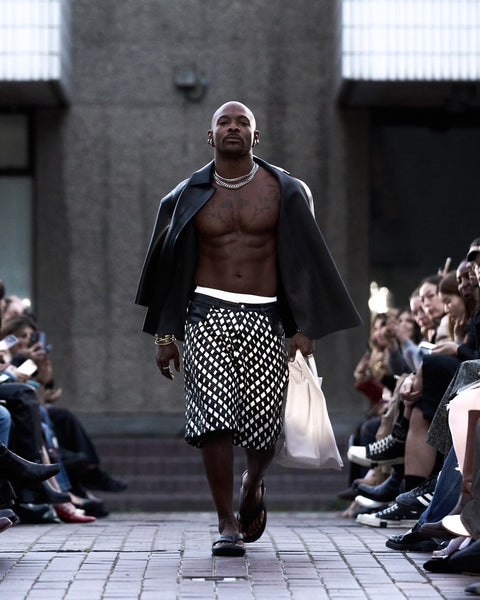 HARRI Black leather jacket paired with black interlaced leather shorts