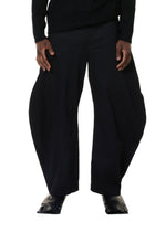 Black wide-leg pants worn by a person on a white background