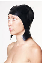 HARRI black cap with ear flaps made of shiny material worn by woman in profile