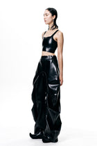 Black Cropped Fitted Tank Top by HARRI worn by model styled with high-waisted black pants