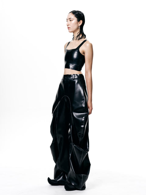 Black Cropped Fitted Tank Top by HARRI worn by model styled with high-waisted black pants