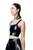 Black Cropped Fitted Tank Top by HARRI modeled with high-waisted black pants on white background