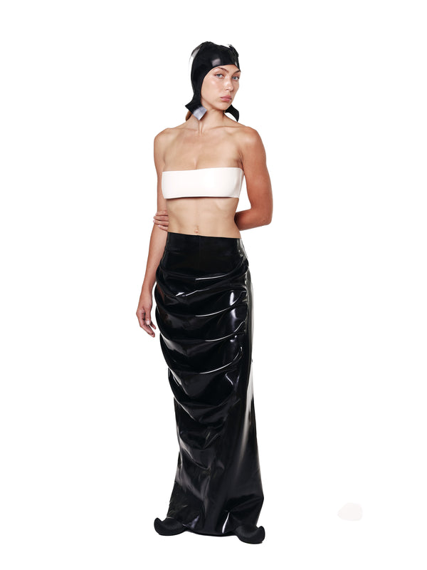 HARRI EXCLUSIVE Black Draped Deflated Maxi Skirt with glossy finish worn by woman in white bandeau top