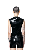 Back view of black fitted zip-up vest top by HARRI on model with tattoos and shaved head
