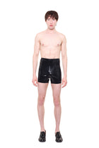 Black High Waist Essential Biker Shorts by HARRI worn by male model with no shirt and black shoes