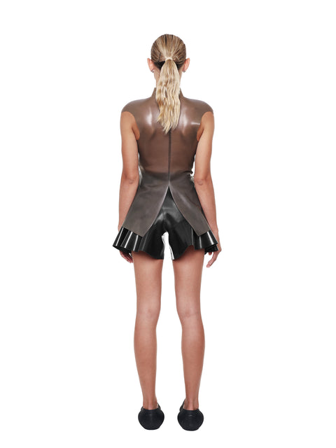 Back view of model wearing HARRI Black High Waist Flared Shorts with ruffle detail