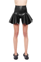 HARRI Black High Waist Flared Shorts made of shiny material shown on a model
