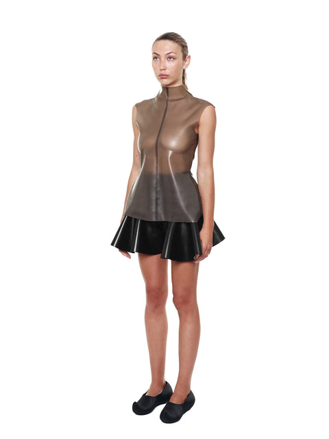 Black High Waist Flared Shorts by HARRI modeled with a sleeveless high neck top and black shoes