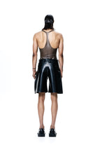 HARRI black knee length pleated shorts worn by a model with a sleeveless brown top and black shoes