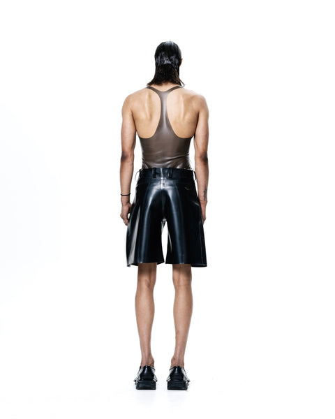 HARRI black knee length pleated shorts worn by a model with a sleeveless brown top and black shoes