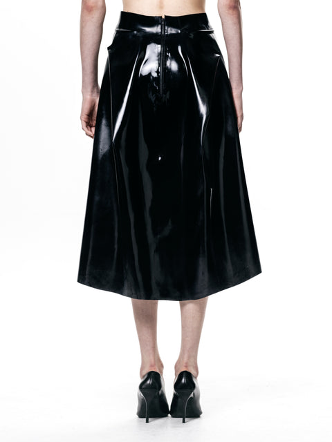 HARRI black pleated skirt in shiny fabric with back zipper detail worn with black heels