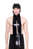 HARRI Black Scarf Cap made of black material worn by male model with long scarf ends