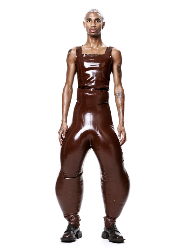 Model wearing HARRI EXCLUSIVE Brown Alien Legs Inflatable Trousers with matching top and black shoes