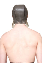 Back view of a person wearing a grey cap with ear flaps made by HARRI