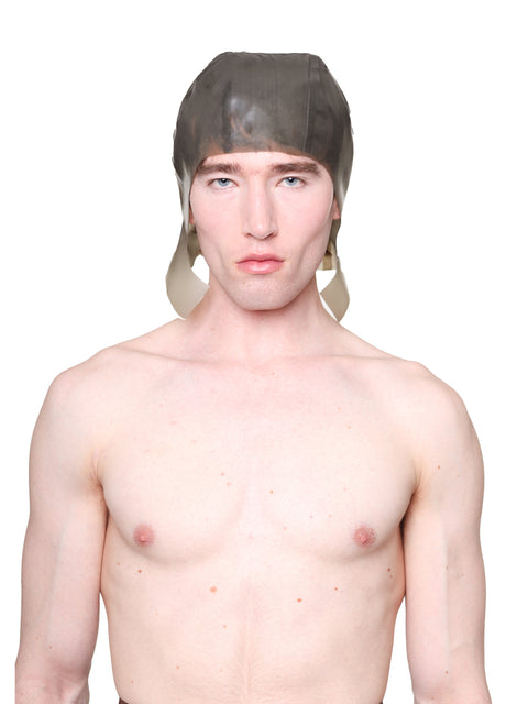 Man wearing a grey cap with ear flaps by HARRI against a white background