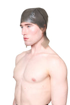 Grey Cap with Ear Flaps by HARRI worn by male model against white background