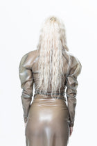 Back view of model wearing grey long sleeve sheer maxi dress by HARRI EXCLUSIVE with puffed shoulders