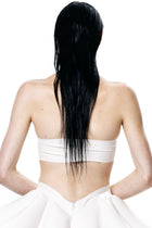 Back view of a woman wearing a white HARRI Tube Top with wet black hair and white skirt
