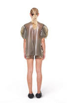 Back view of HARRI Grey Short Sleeve Structured Cape Top worn with matching shorts
