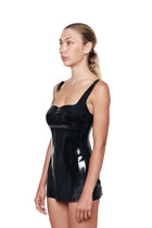 HARRI little black dress with square neck glossy fitted design on model side view