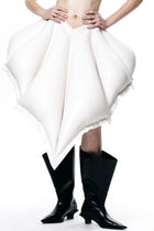 White V-Waisted Inflatable Midi Skirt by HARRI EXCLUSIVE worn with black boots